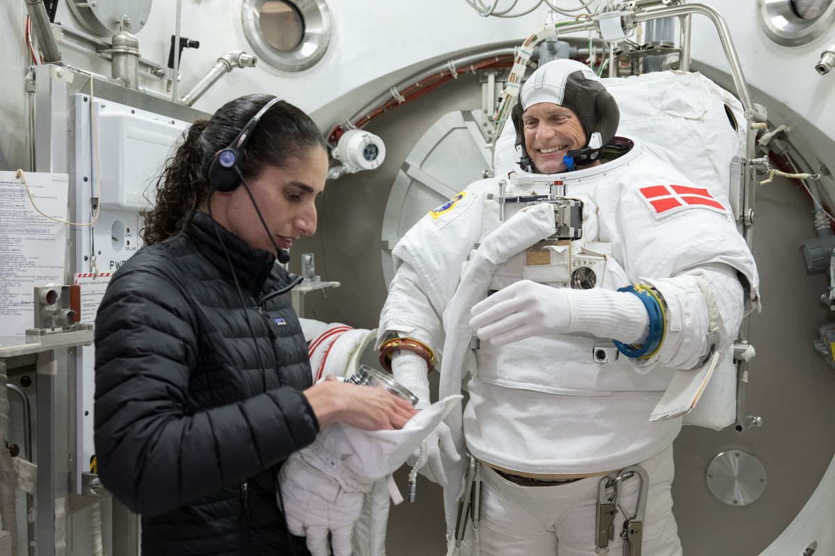 Andreas Mogensen and Jasmin Moghbeli suiting up for EVA training